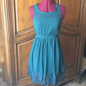 Teal dress with beautiful details.